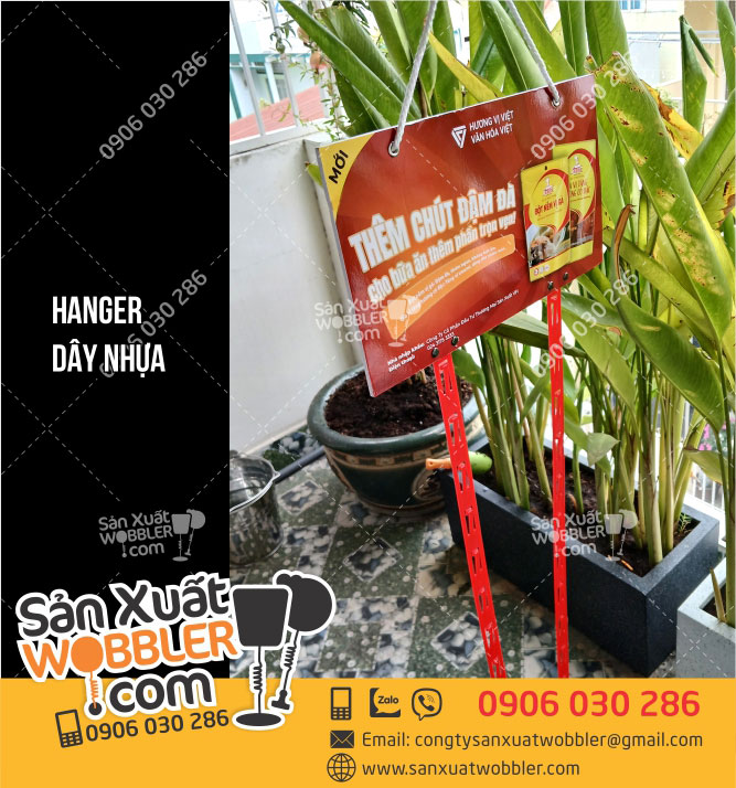 Hanger-gắn-2-dây-nhựa-quảng-cáo-Hạt-nêm-vị-gà
